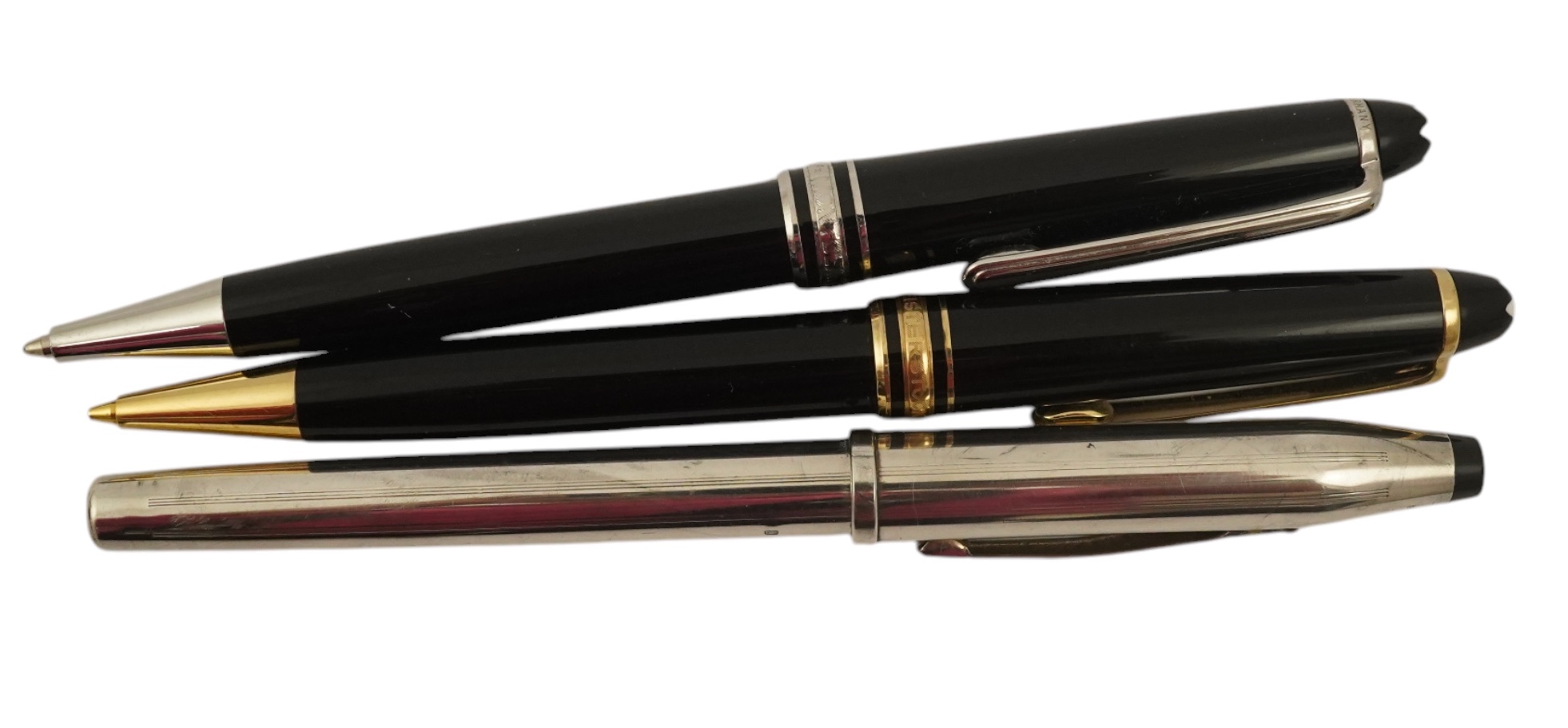 A Montblanc ballpoint pen, a Montblanc pencil and a Cross fountain pen